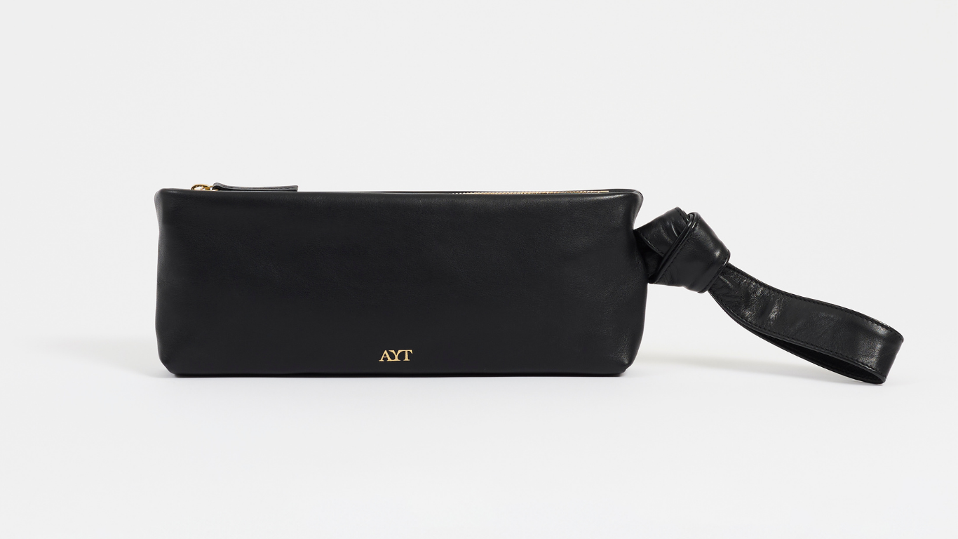 Black pouch with a strap on a white background