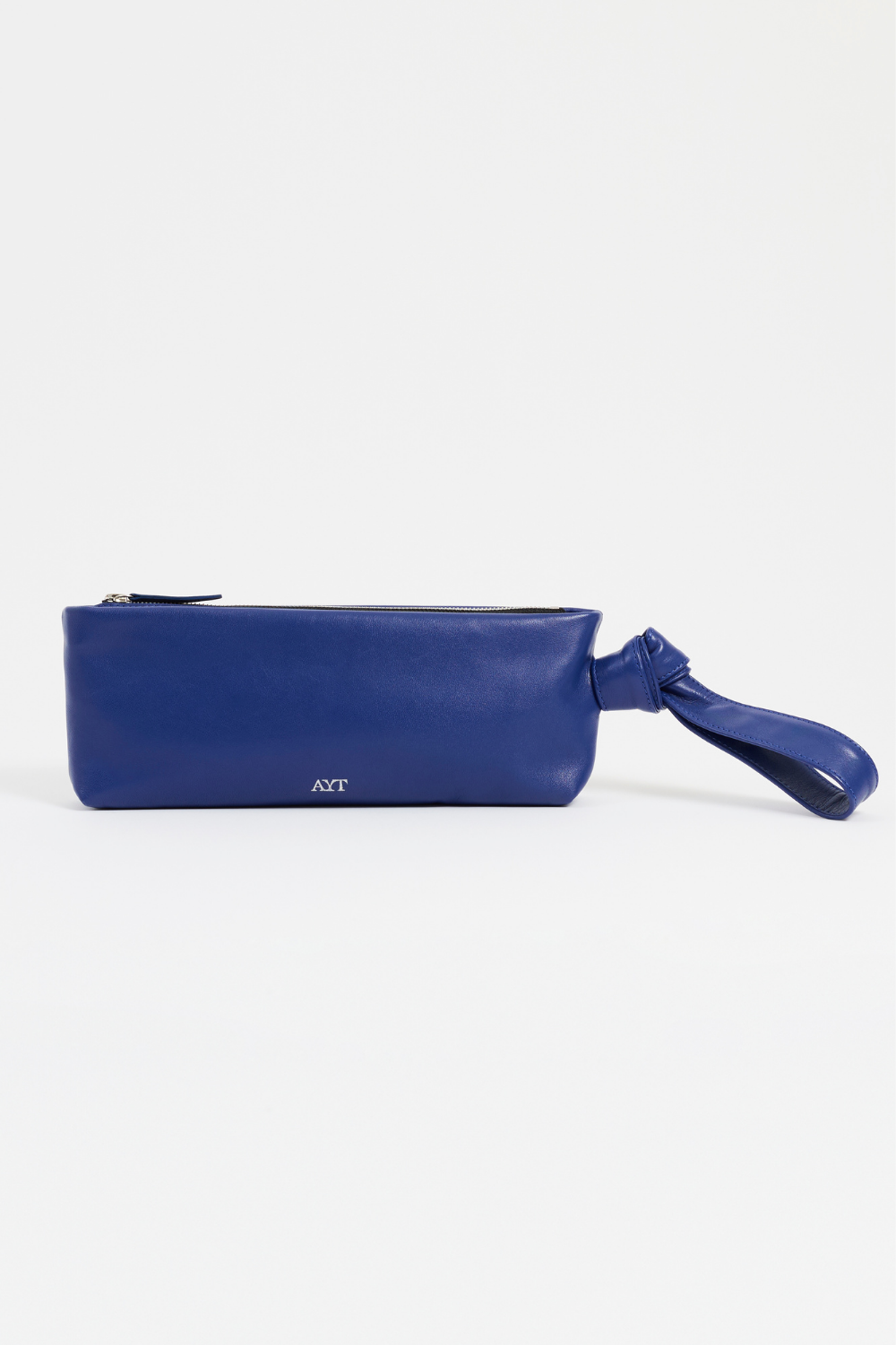 Front view of AYT Studio 'FOULARD' Baguette bag in smooth blue leather with knotted scarf-inspired handle and signature blue lining.