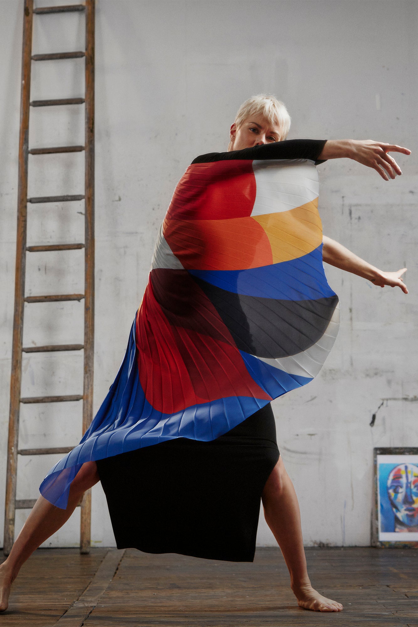 AYT STUDIO x French painter REMED 'ENVOL' long, maxi dress in a fluid jersey fabric with asymmetrical single sleeve, pleated, sculptural graphic patterned panel. Inspired by the painting 'Bel Envol.'