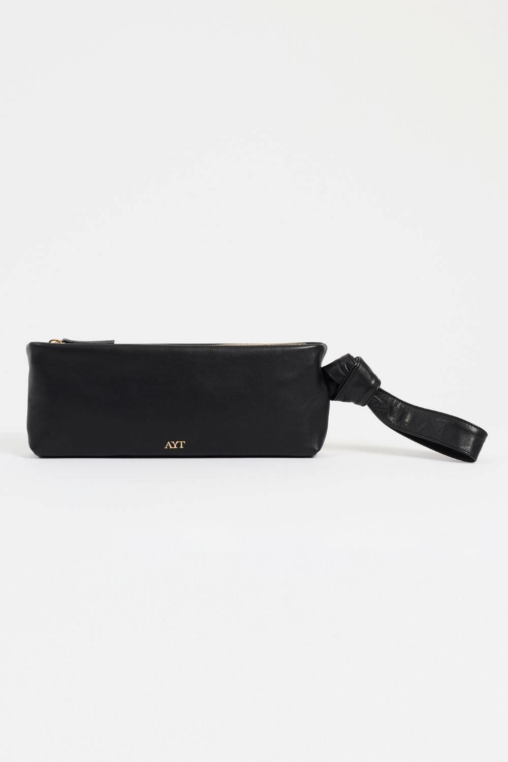 Rear view of AYT Studio x Remed 'FOULARD' black leather baguette bag with a copper-inspired artistic print, a scarf-inspired wrist strap, and small gold 'AYT' logo.