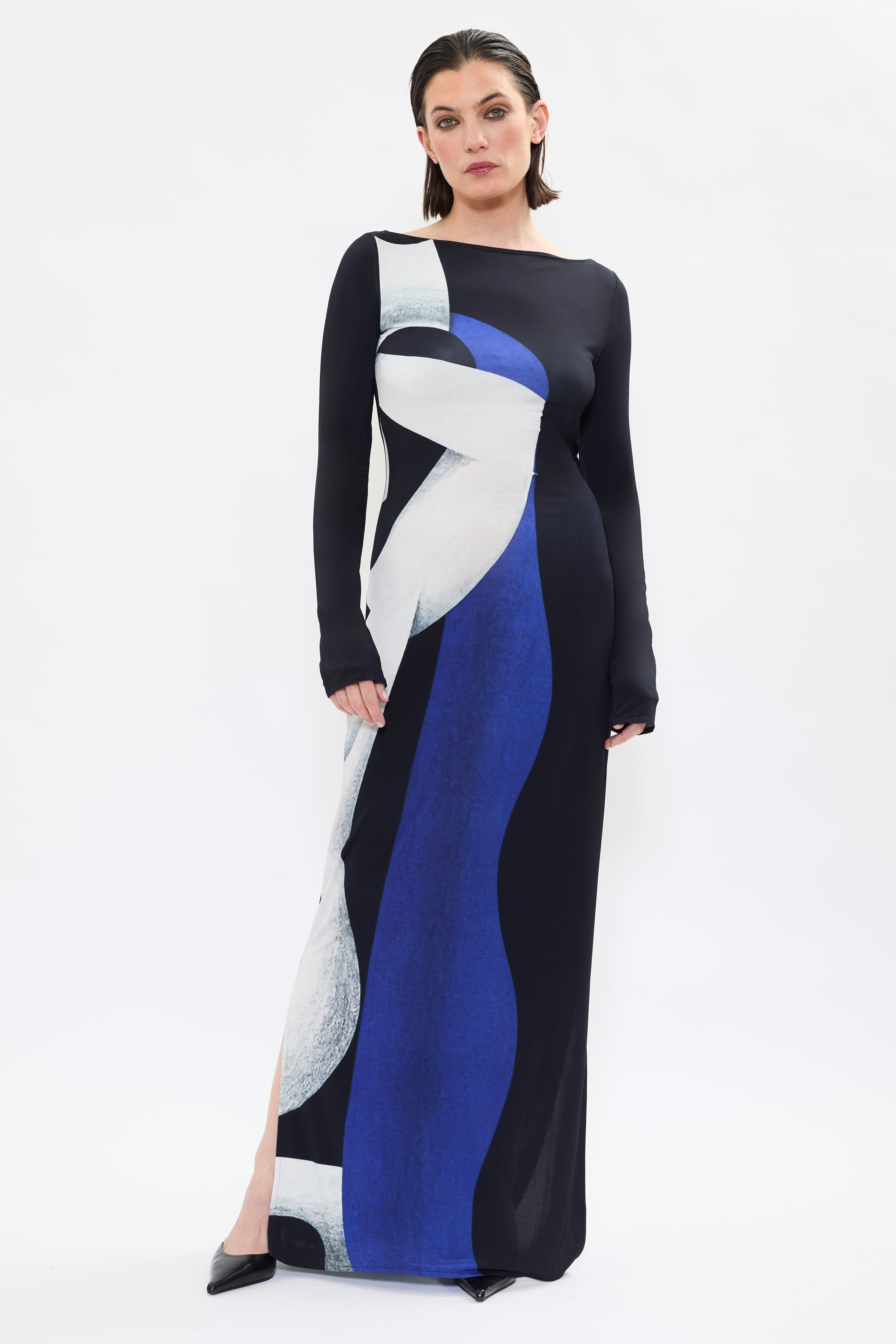 Subtle slit detail of AYT STUDIO X REMED 'Temperance' dress with a fluid silhouette, long sleeves and boat neckline highlight the elegant simplicity of the cut with a bold artistic print.