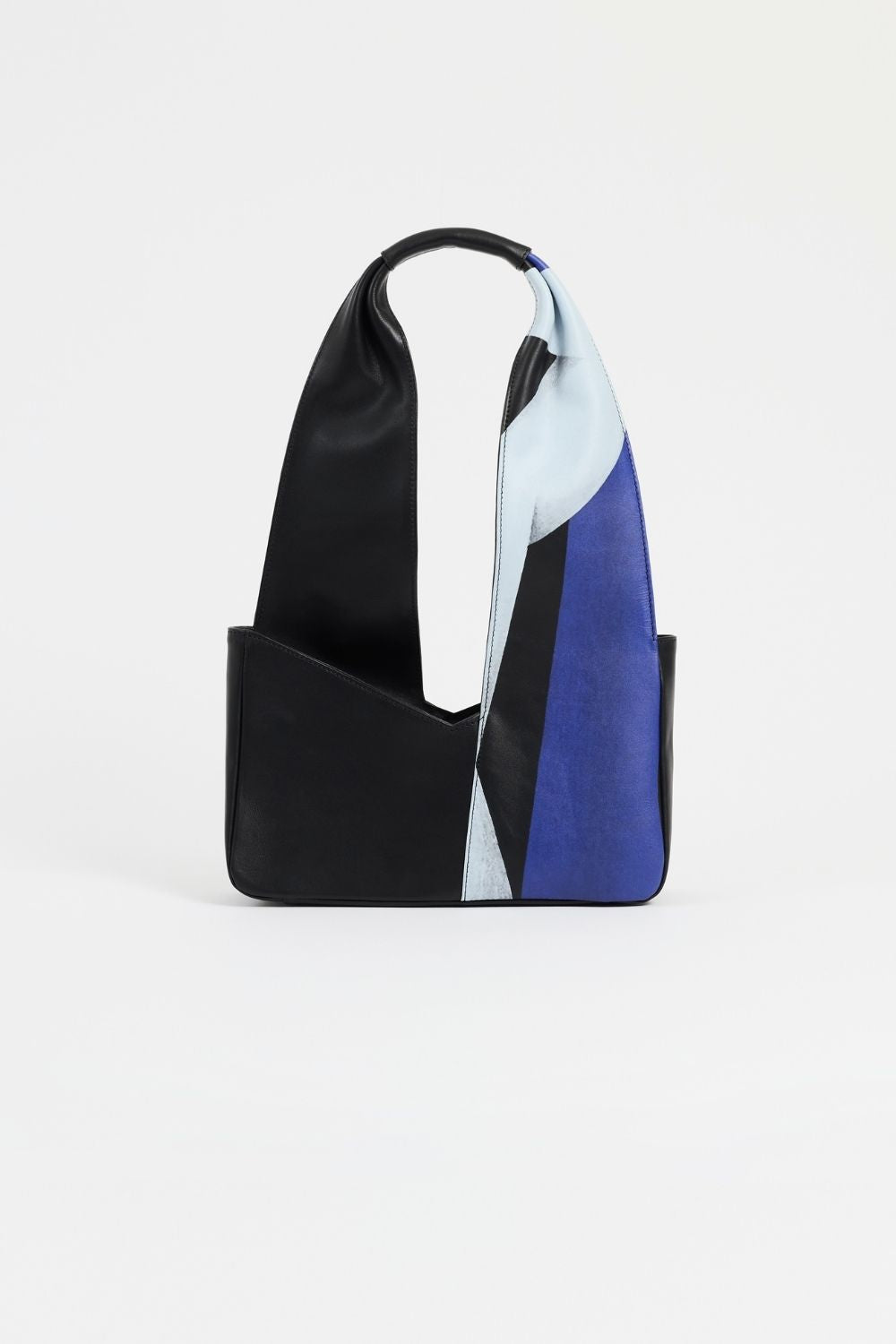 The Temperance shoulder bag is in black leather with vibrant a vibrant artistic print in collaboration with French artist REMED.