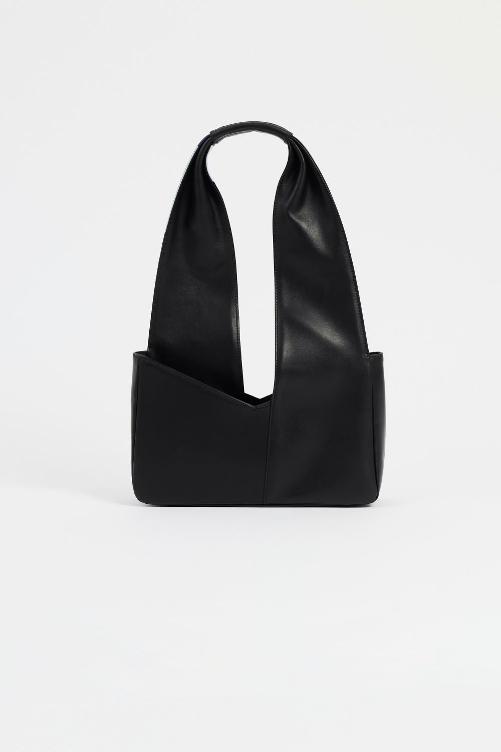 The Temperance shoulder bag is in black leather with vibrant a vibrant artistic print in collaboration with French artist REMED.