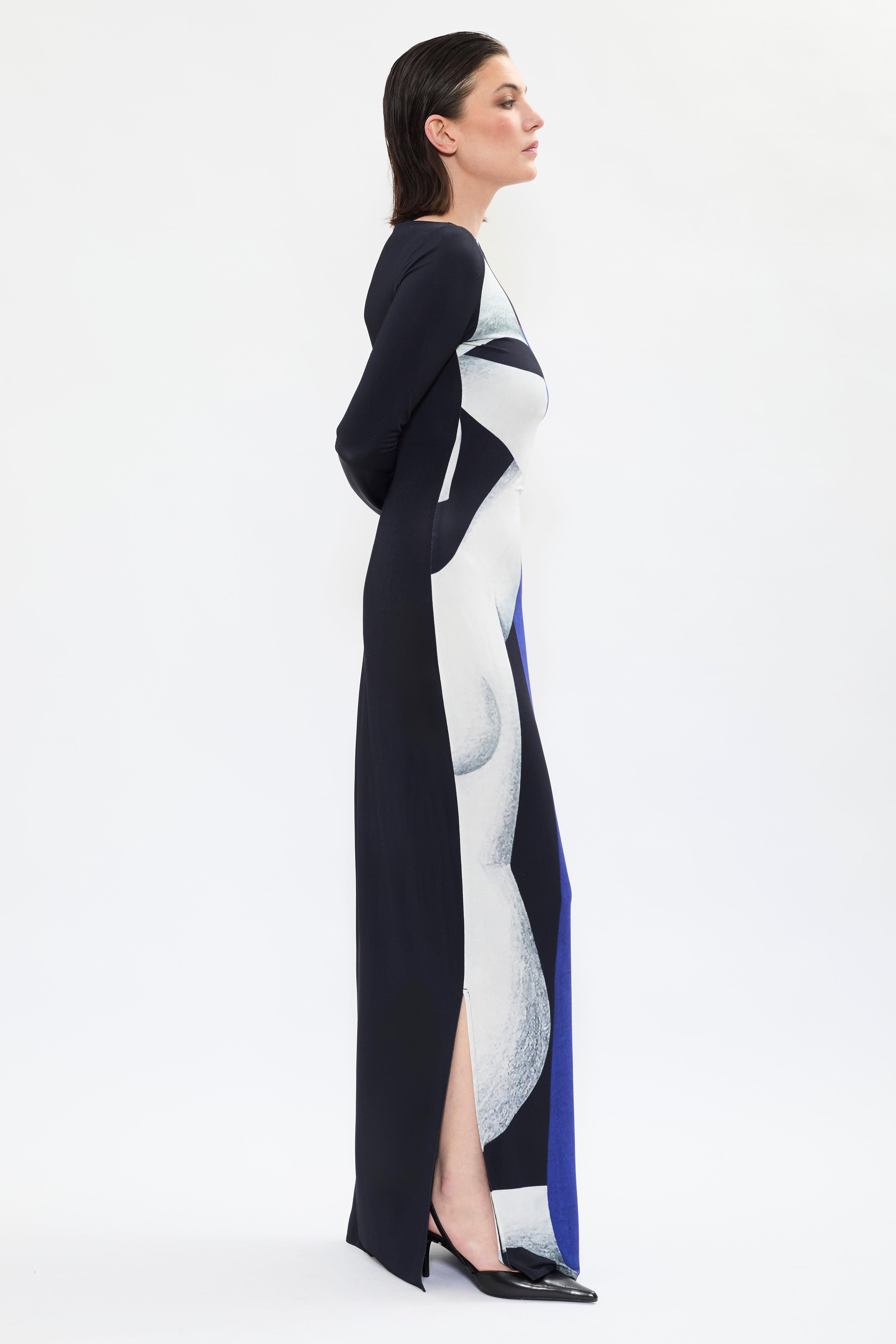 The ‘Temperance’ dress by AYT Studio. A fluid silhouette, long sleeves and boat neckline highlight the elegant simplicity of the cut with a bold artistic print from the Artist REMED