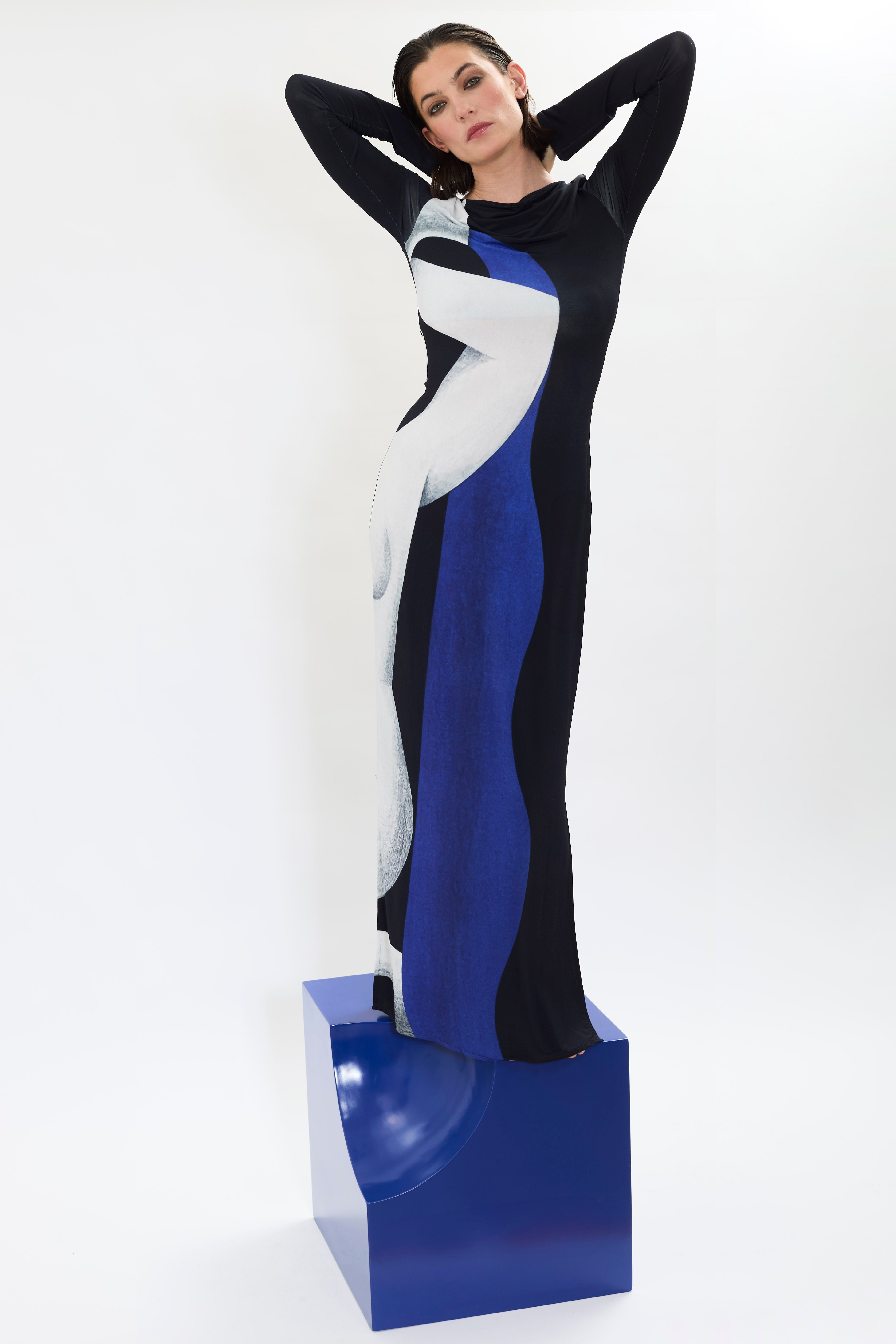 The ‘Temperance’ dress by AYT Studio. A fluid silhouette, long sleeves and boat neckline highlight the elegant simplicity of the cut with a bold artistic print from the Artist REMED