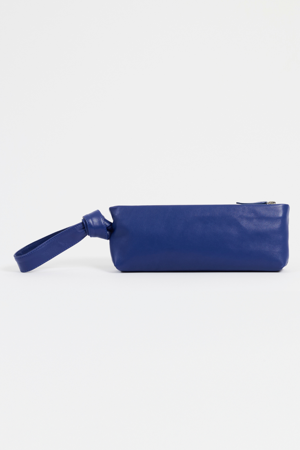 Rear view of Front view of AYT Studio 'LIEN' elongated leather pouch in smooth blue leather with knotted scarf-inspired wrist strap