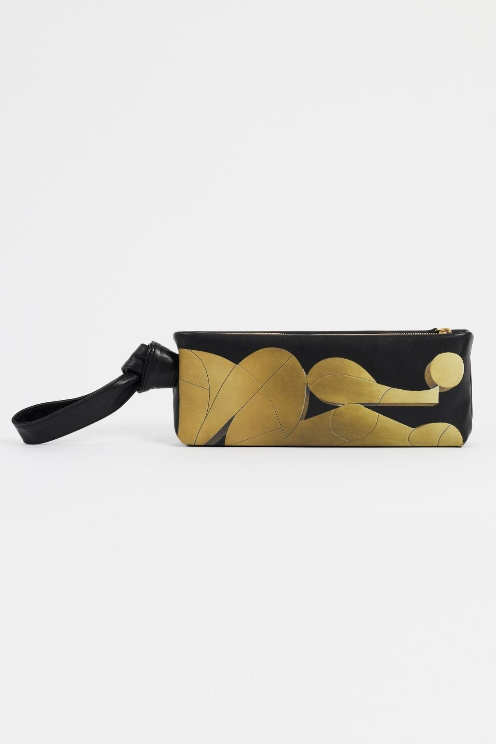 Front view of AYT Studio x Remed 'FOULARD' black leather baguette bag with a copper-inspired artistic print and a scarf-inspired wrist strap.