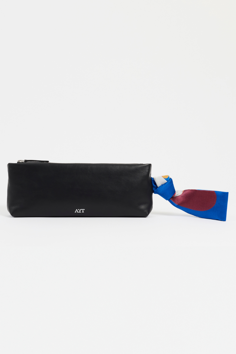 Rear view of AYT Studio x REMED 'FOULARD' Baguette, made of smooth black Italian leather with vibrant printed silk foulard handle, limited edition