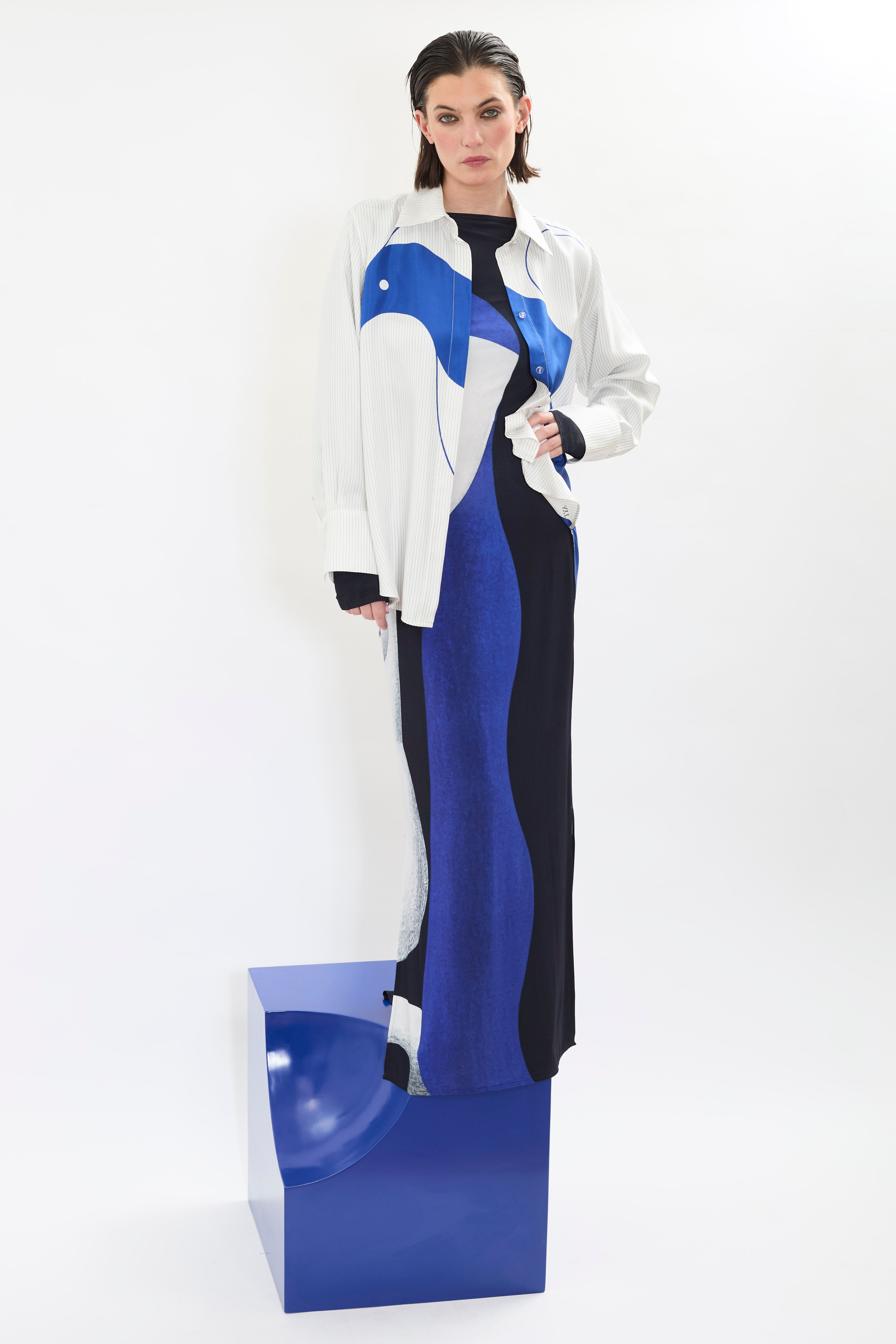 Model styling of AYT STUDIO x REMED lightweight 100% Italian silk pinstripe shirt with an artistic design inspired by the painting 'Three Birds. The Blue.' Paired with 'TEMPERANCE' dress.