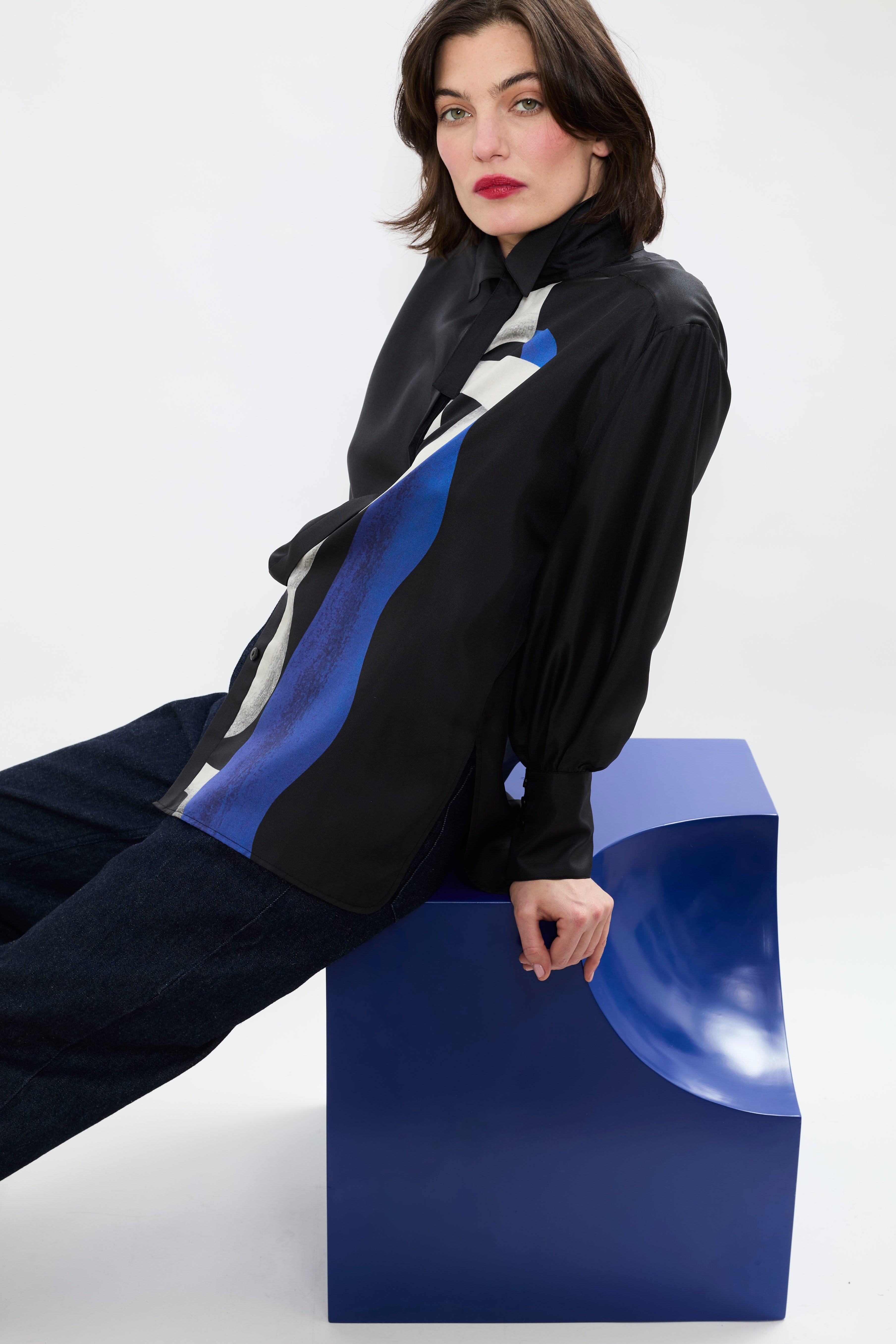 Side view of AYT STUDIO x REMED lightweight black 100% silk shirt with an artistic design inspired by the painting 'Temperance' with broken collar and wide tightened cuff.