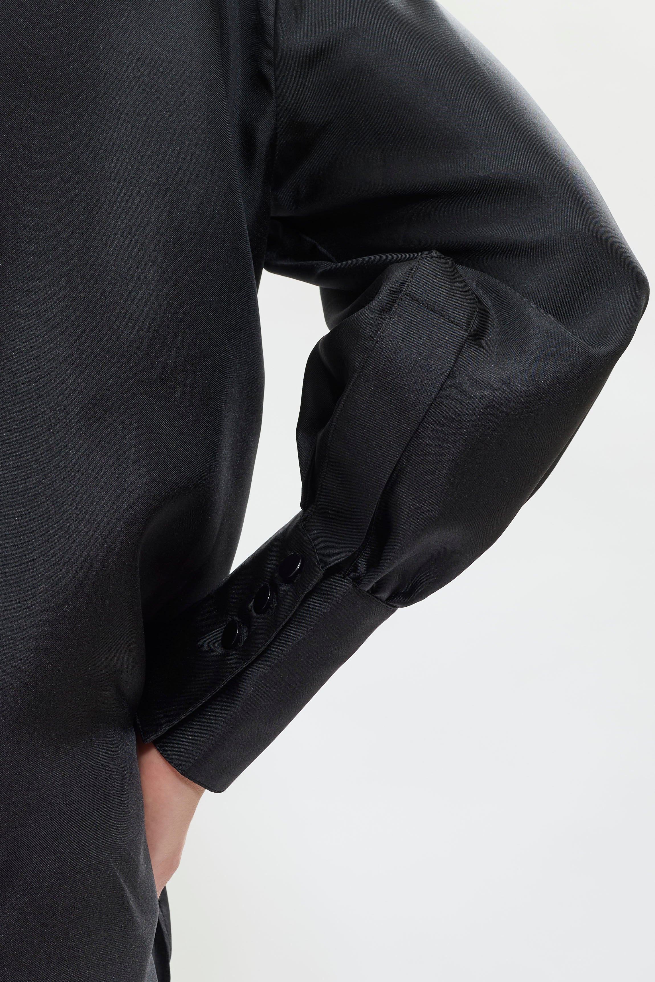 Details of AYT STUDIO x REMED lightweight black 100% silk shirt with an artistic design inspired by the painting 'Temperance,' wide tightened cuff and delicate gathers.